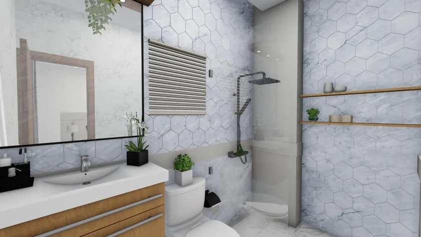 Baño de Torre Emir revestido en mármol hexagonal, con ducha de lluvia a ras de piso y mueble de madera clara