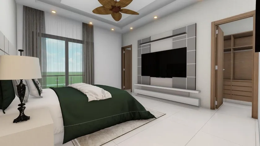 Habitación principal de Torre Emir con cabecero tapizado, panel de televisión empotrado y salida al balcón