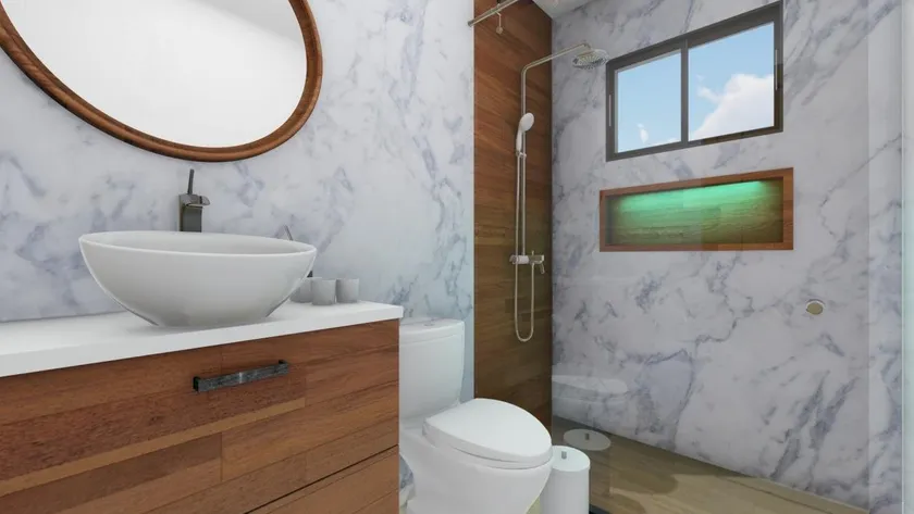 Baño de Venecia Blue en mármol blanco, con espejo redondo, lavamanos de vasija y ducha con nicho de madera
